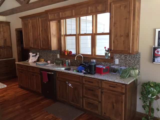 https://valleycustomcabinets.com/wp-content/uploads/2016/02/Rustic-Knotty-Alder-Kitchen-Cabinets-New-Home-Stillwater-MN.jpg